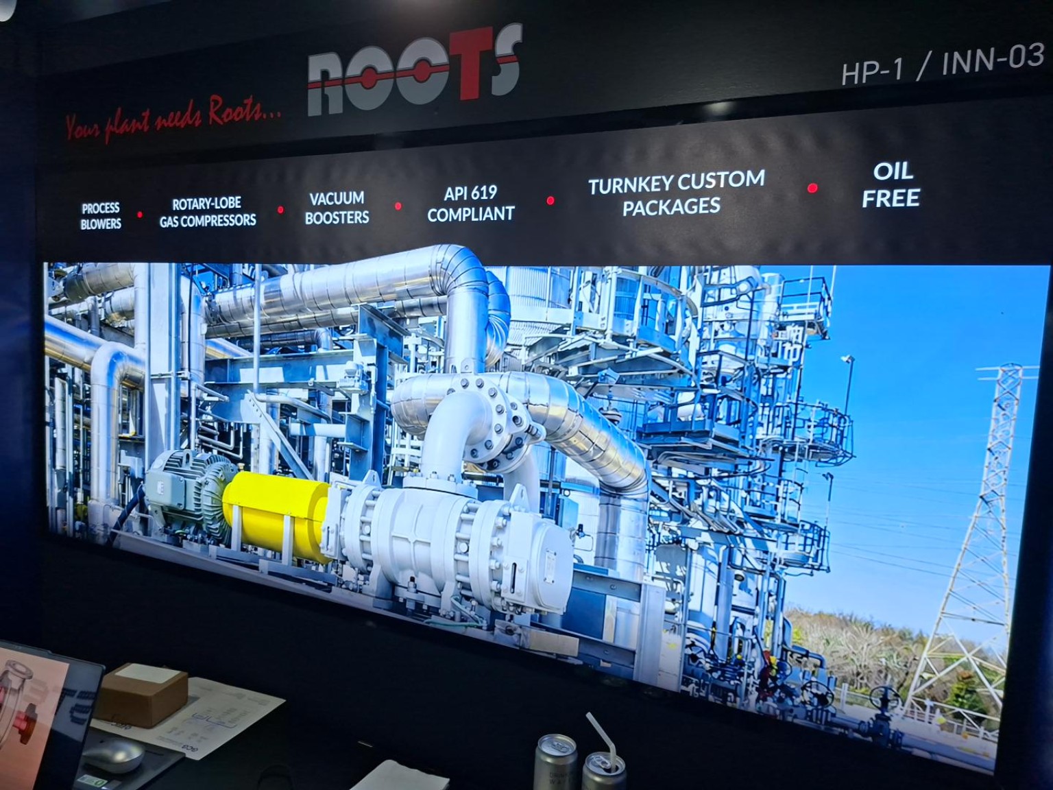 ROOTS Systems display showing process blowers, rotary-lobe gas compressors and vacuum boosters