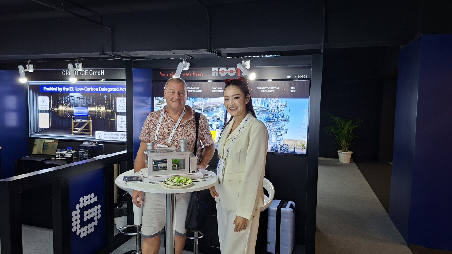 Bill Gray visiting the ROOTS Systems display at Gastech 2026 in Bangkok